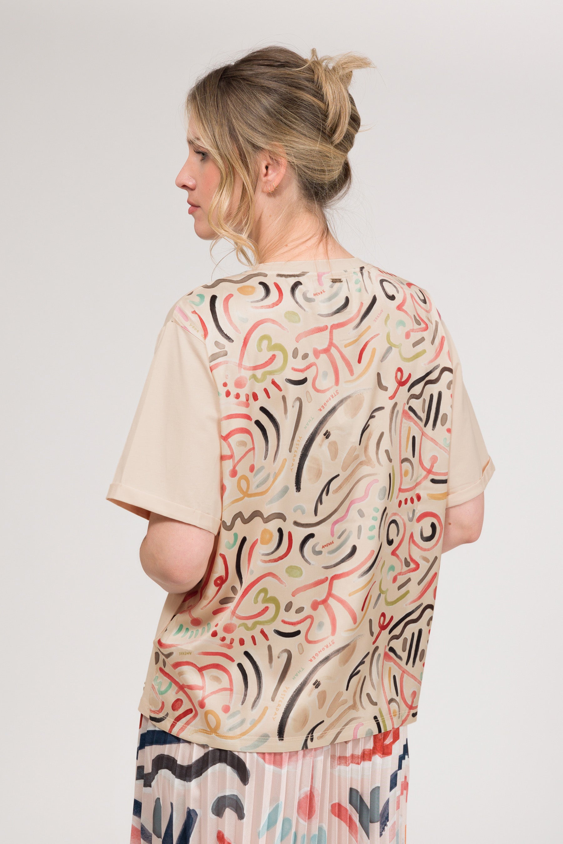 Maglietta a maniche corte beige con stampa
