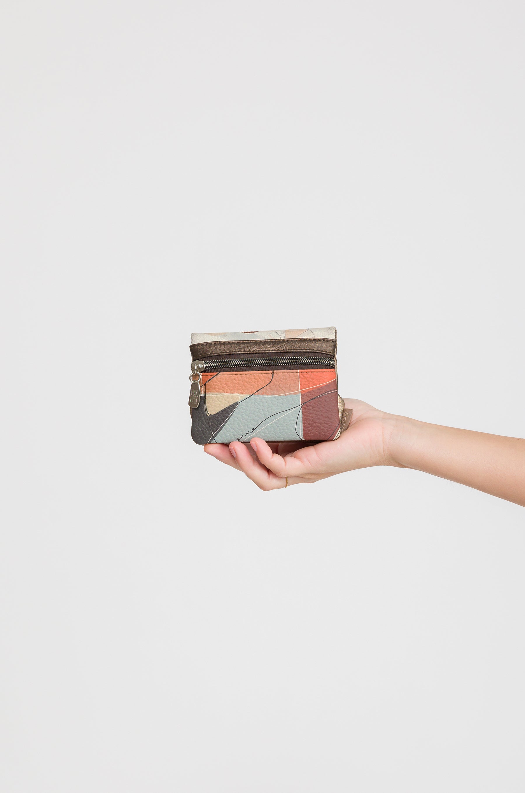 Portamonete con patta Sophia