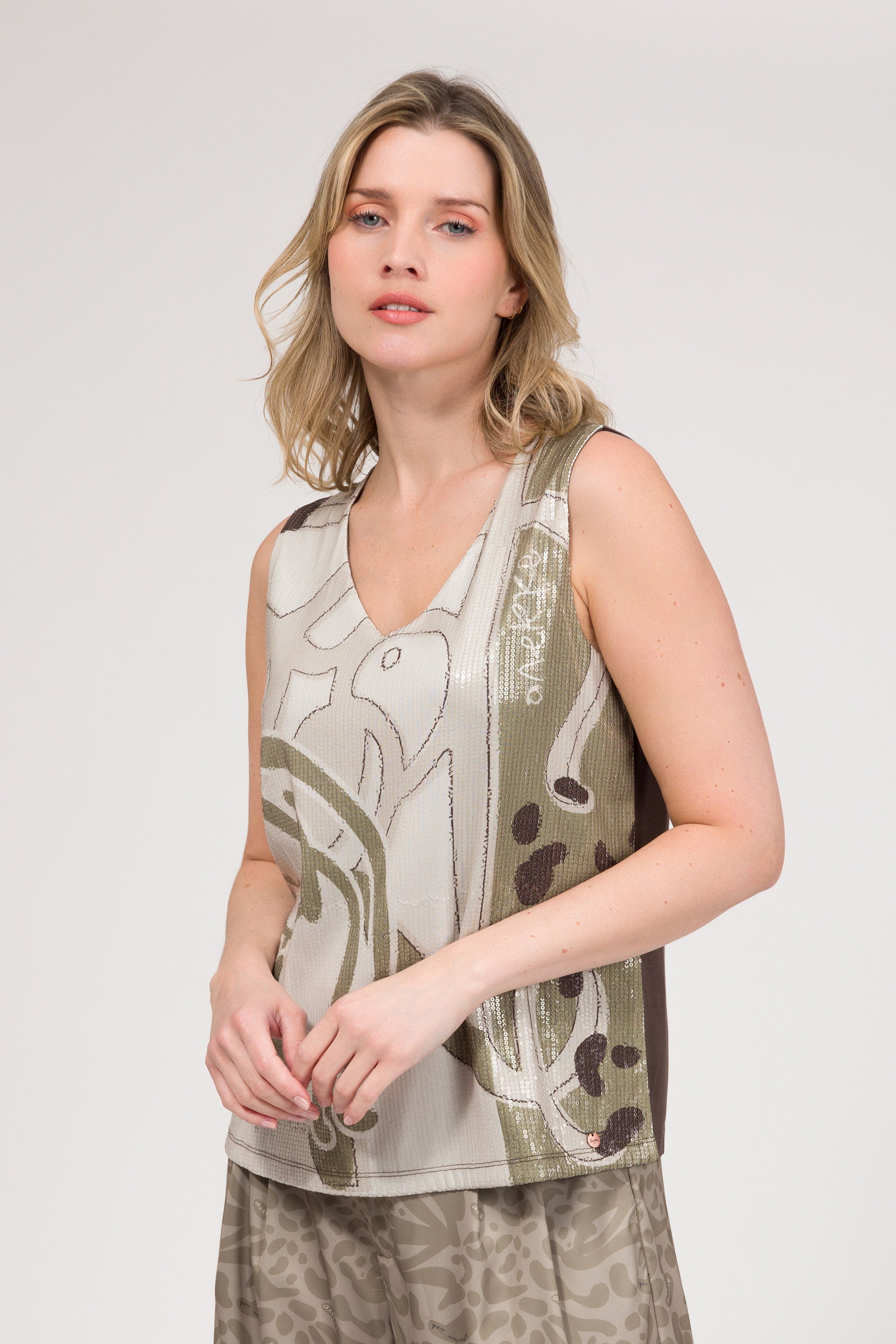 Maglietta beige con paillettes